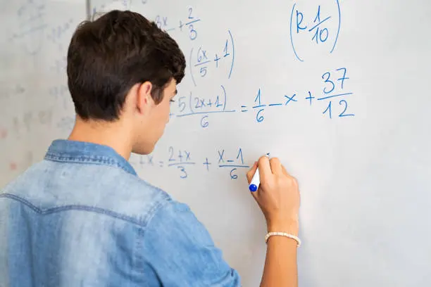 Image showing a mathematician contemplating a complex equation with symbols representing infinity, reflecting the deep contemplation and exploration of the concept of infinity in the realm of higher mathematics